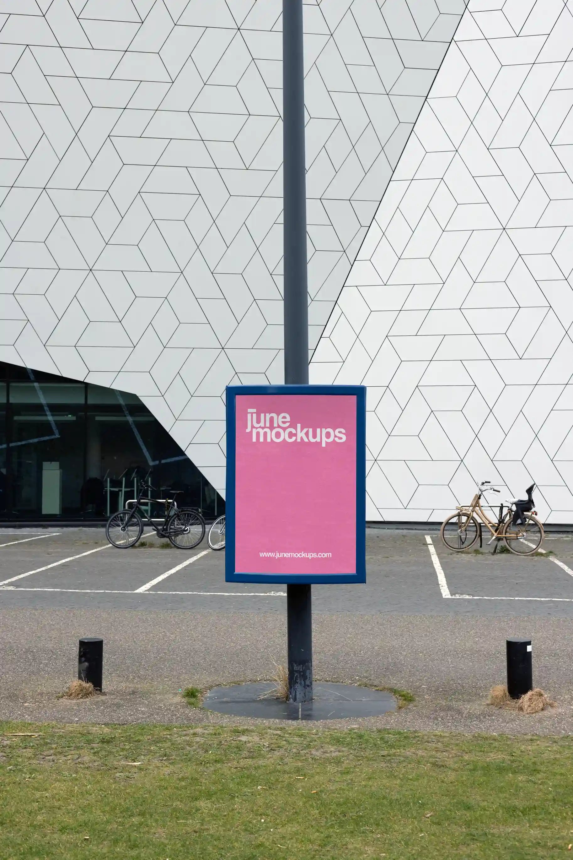Street pole poster mockup near Eye Filmmuseum in Amsterdam with geometric modern building facade, ideal for outdoor advertising design