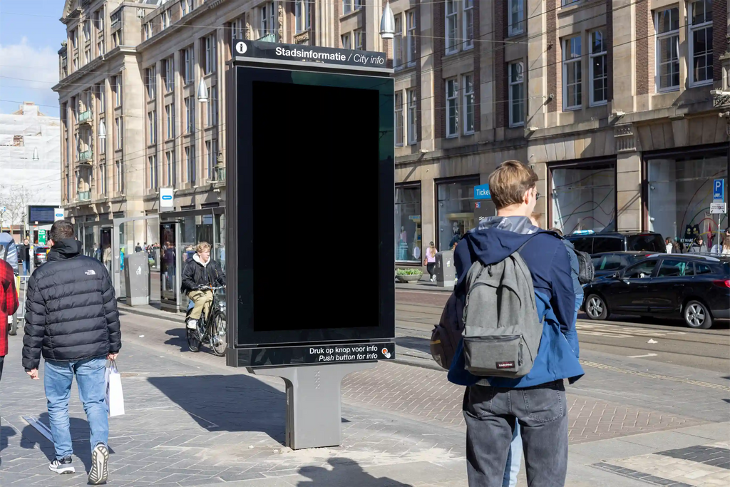 Amsterdam city light poster mockup at Dam Square with pedestrians and urban architecture.