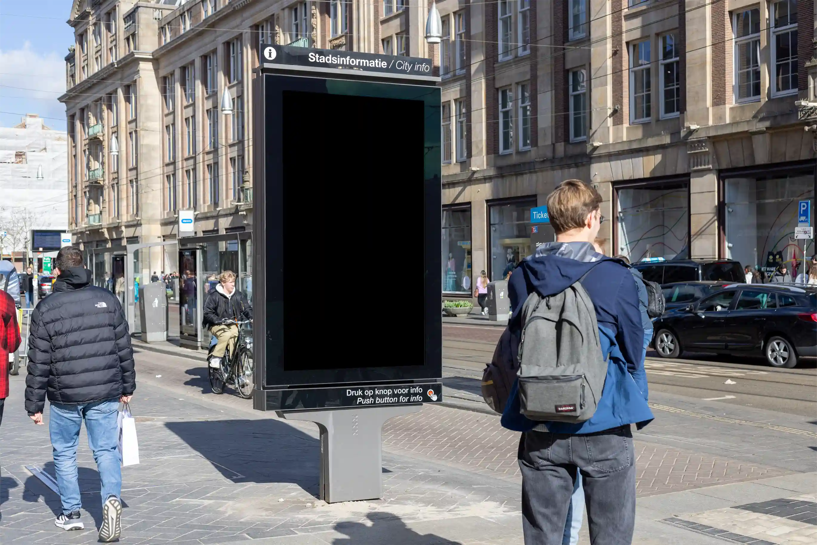 Amsterdam city light poster mockup at Dam Square with pedestrians and urban architecture.