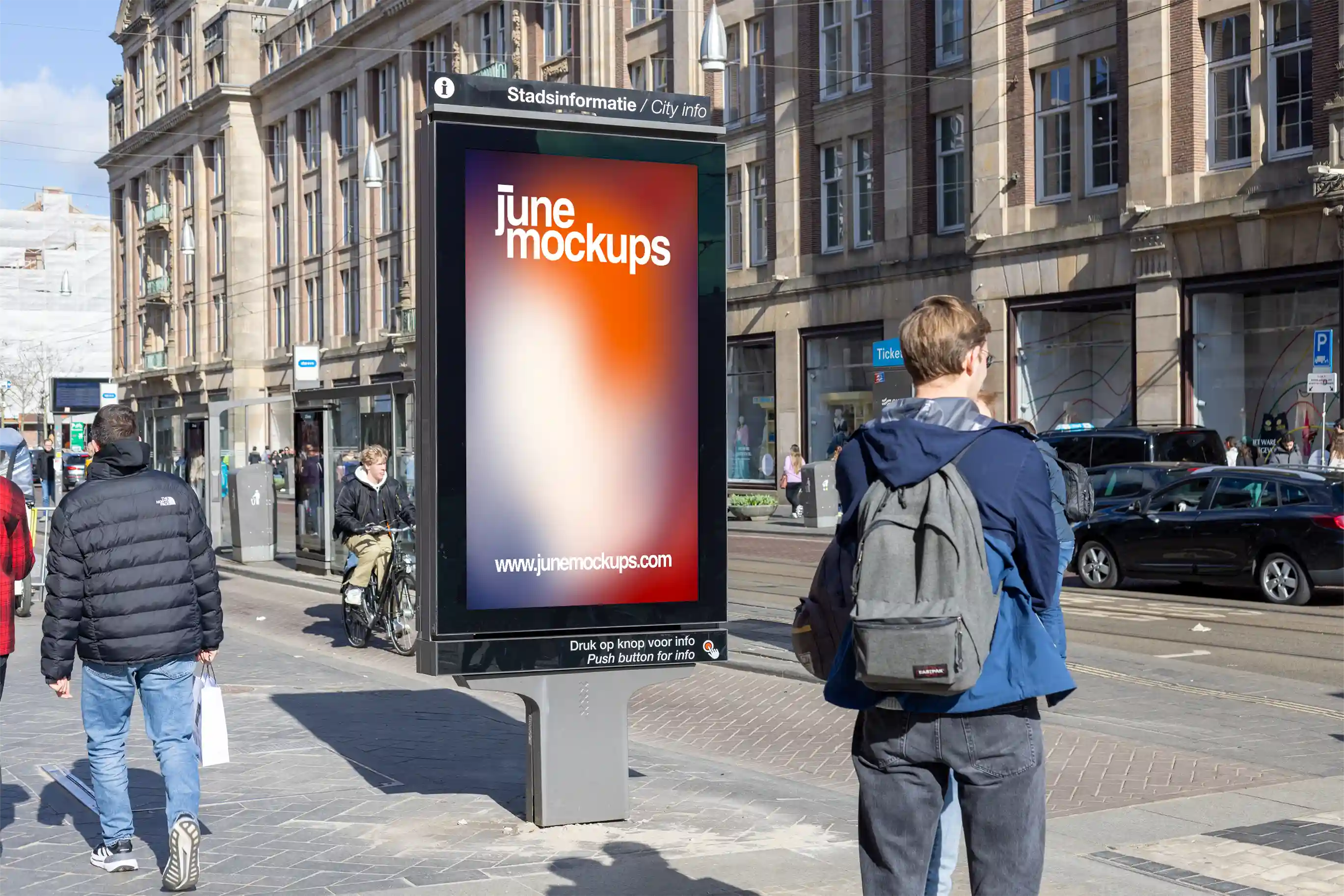 Amsterdam city light poster mockup at Dam Square with pedestrians and urban architecture.