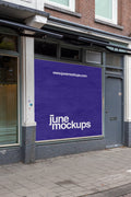 Large square storefront poster mockup in Amsterdam De Pijp featuring a realistic urban shop window facade with brick architecture, high resolution PSD template for branding and advertising presentations.