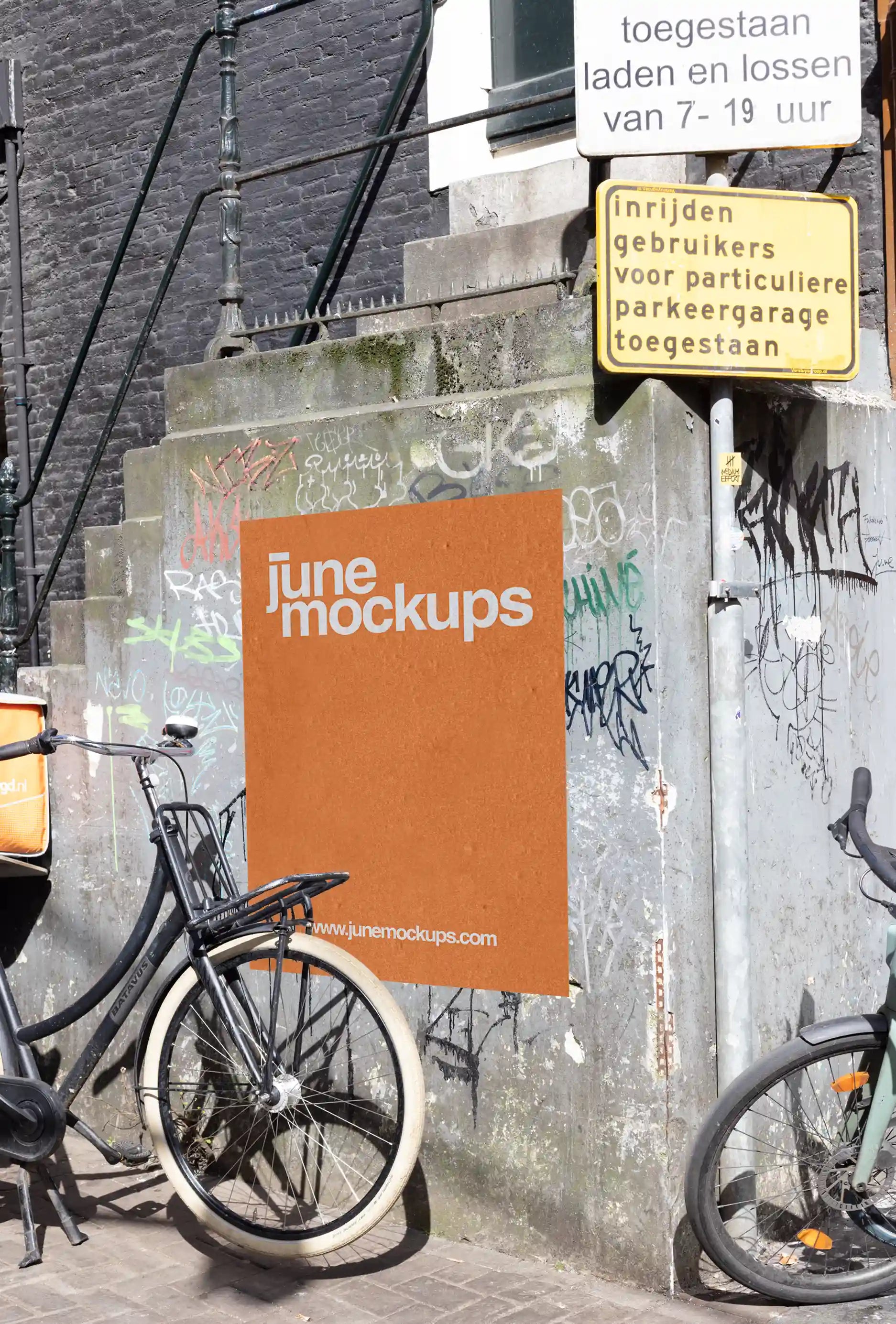 Amsterdam urban poster mockup at Leidseplein with bicycles and graffiti-covered wall.