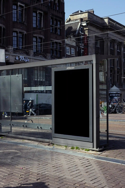 Amsterdam city light poster mockup at Prinsengracht tram stop with historic buildings.