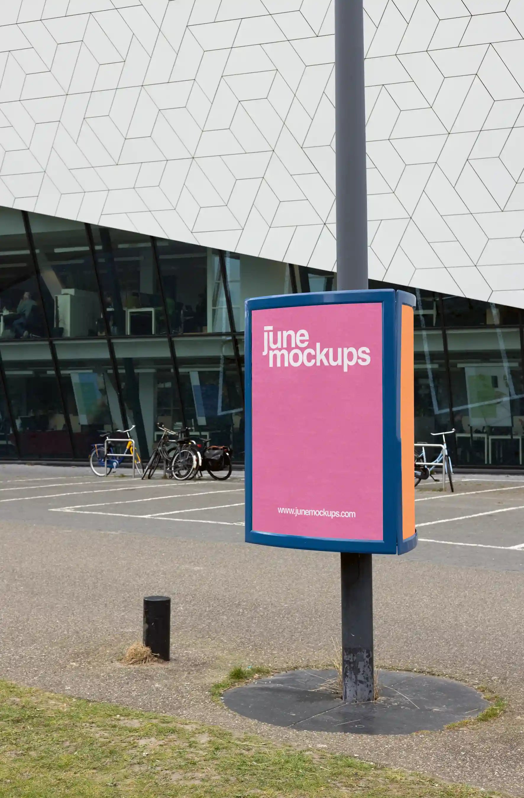 two street pole poster mockup near Eye Filmmuseum in Amsterdam with geometric modern building facade, ideal for outdoor advertising design.