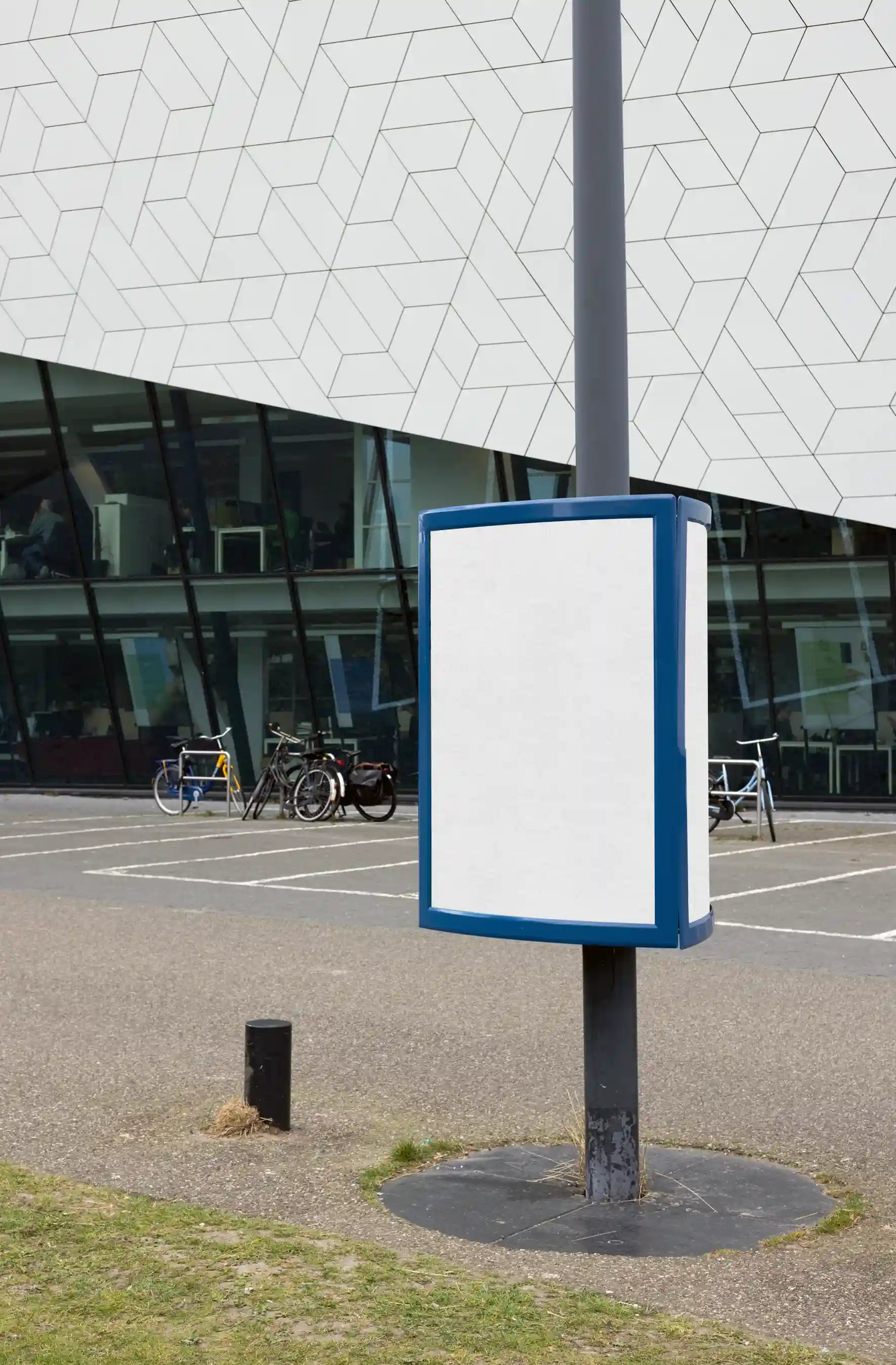 Street pole poster mockup near Eye Filmmuseum in Amsterdam with geometric modern building facade, ideal for outdoor advertising design.