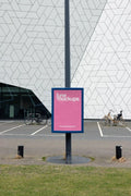Street pole poster mockup near Eye Filmmuseum in Amsterdam with geometric modern building facade, ideal for outdoor advertising design