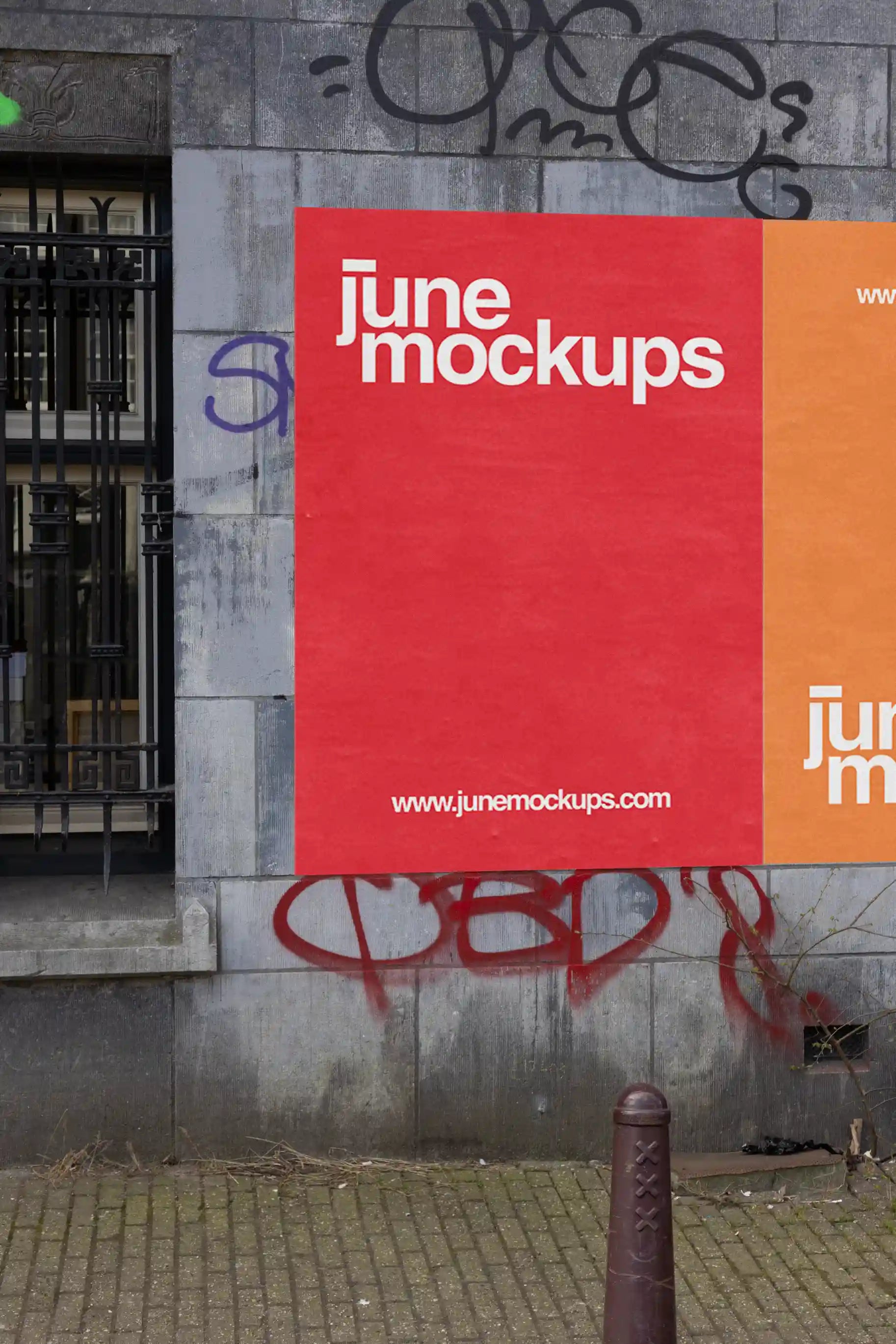Amsterdam urban street mockup with two colorful posters, red and orange, on a graffiti-covered wall.