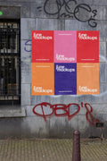 Amsterdam urban street mockup with six colorful posters arranged in a grid on a weathered wall.