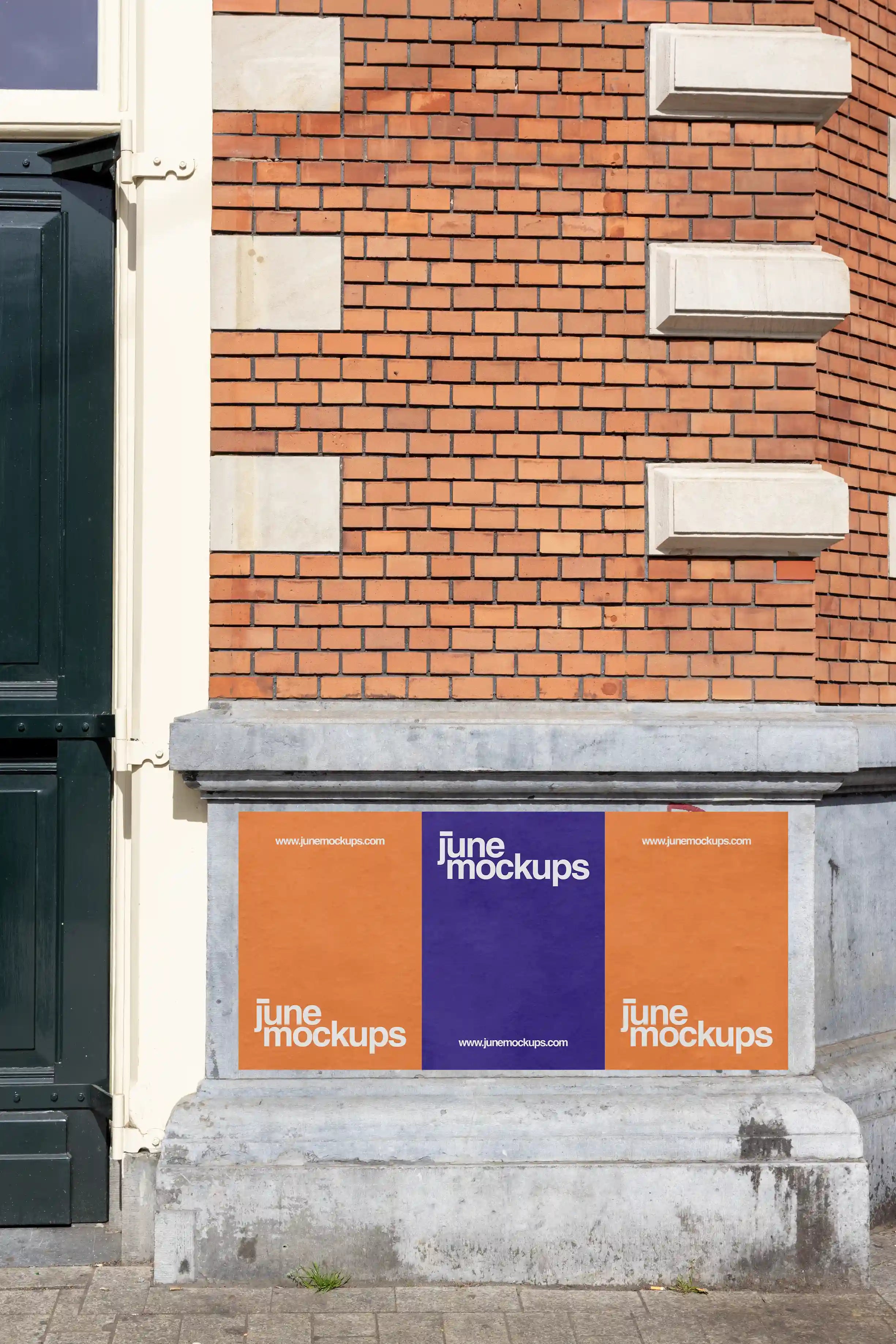 Amsterdam urban street poster mockup on a classic brick facade with three posters in orange and purple, perfect for realistic design presentations