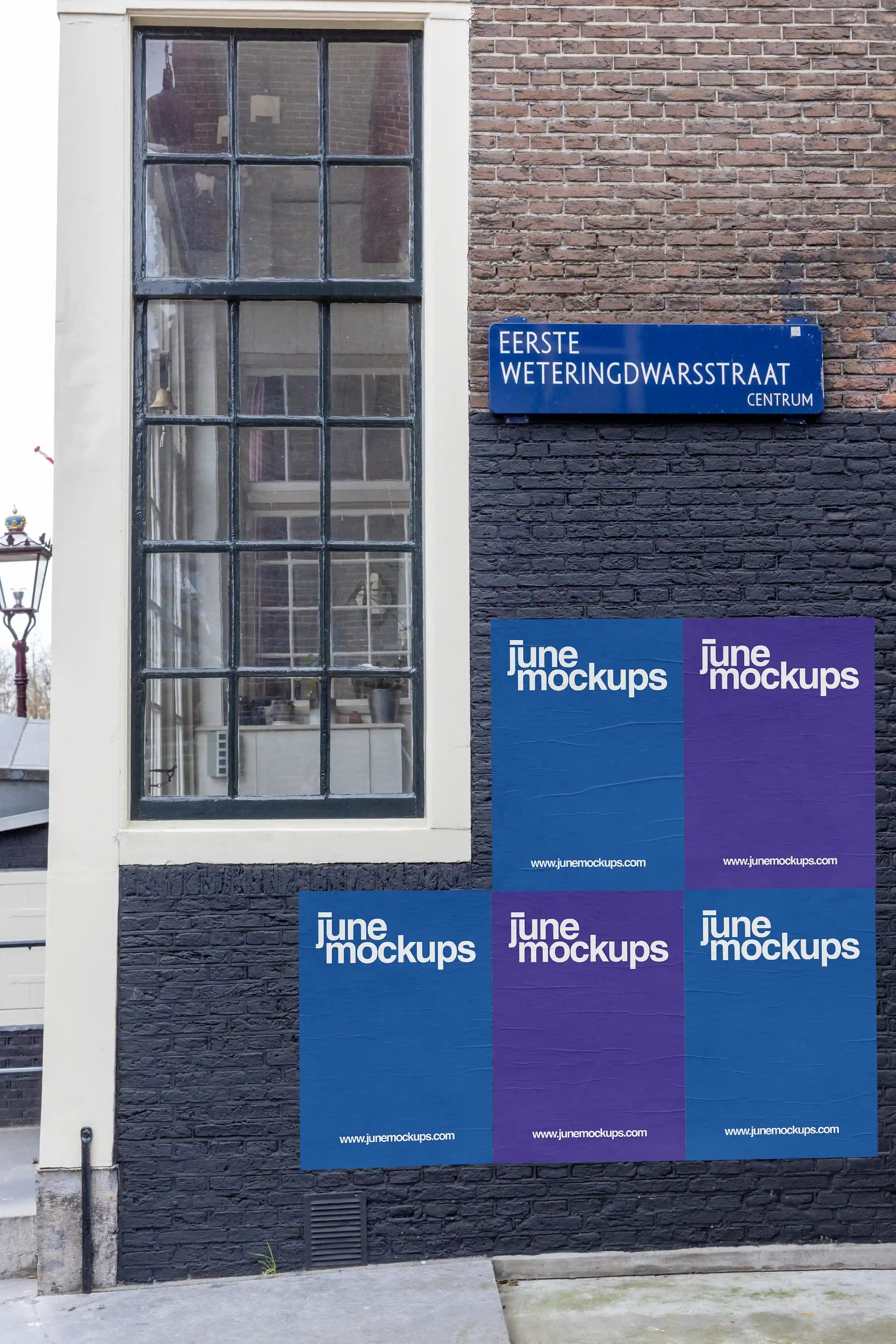 Close-up of an Amsterdam urban street poster mockup on Eerste Weteringdwarsstraat, brick wall with large vintage window.