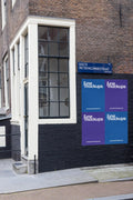 Urban street poster mockup in Amsterdam on the corner of Eerste Weteringdwarsstraat with classic brick facade and large window.