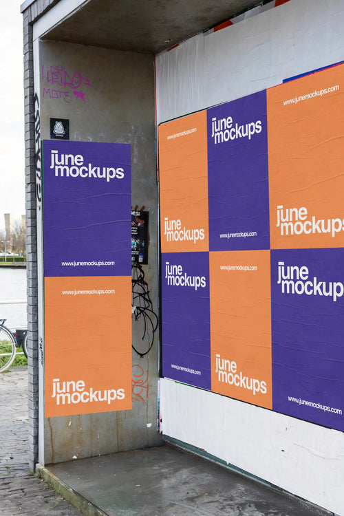Urban street poster mockups in Amsterdam on the waterfront side, featuring alternating orange and purple posters