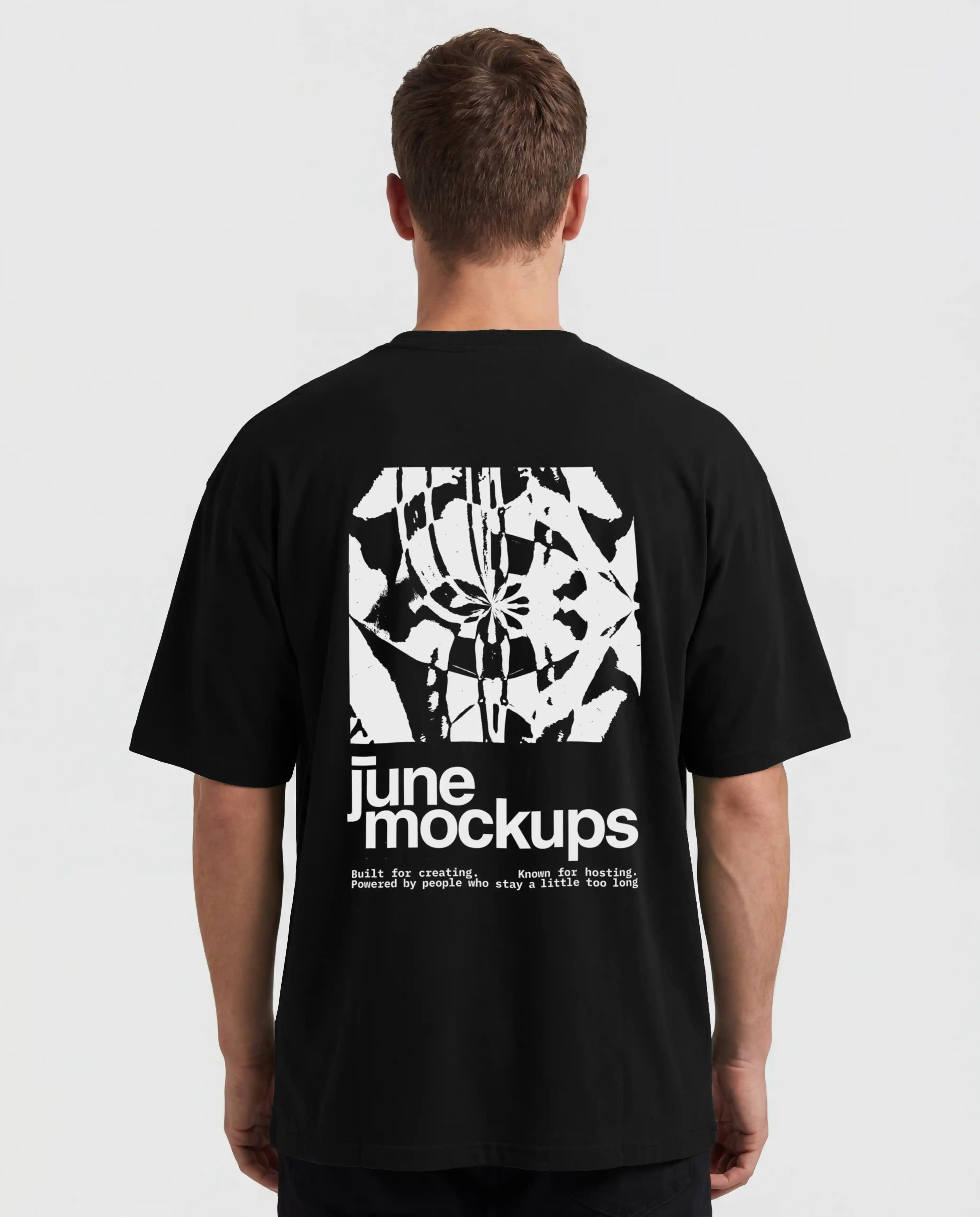 Realistic black streetwear t-shirt mockup showing a male model from the back with a large back print design, oversized fit, clean studio background and natural fabric folds, perfect for apparel branding, merch collections, music merchandise, fashion campaigns and streetwear clothing presentations.