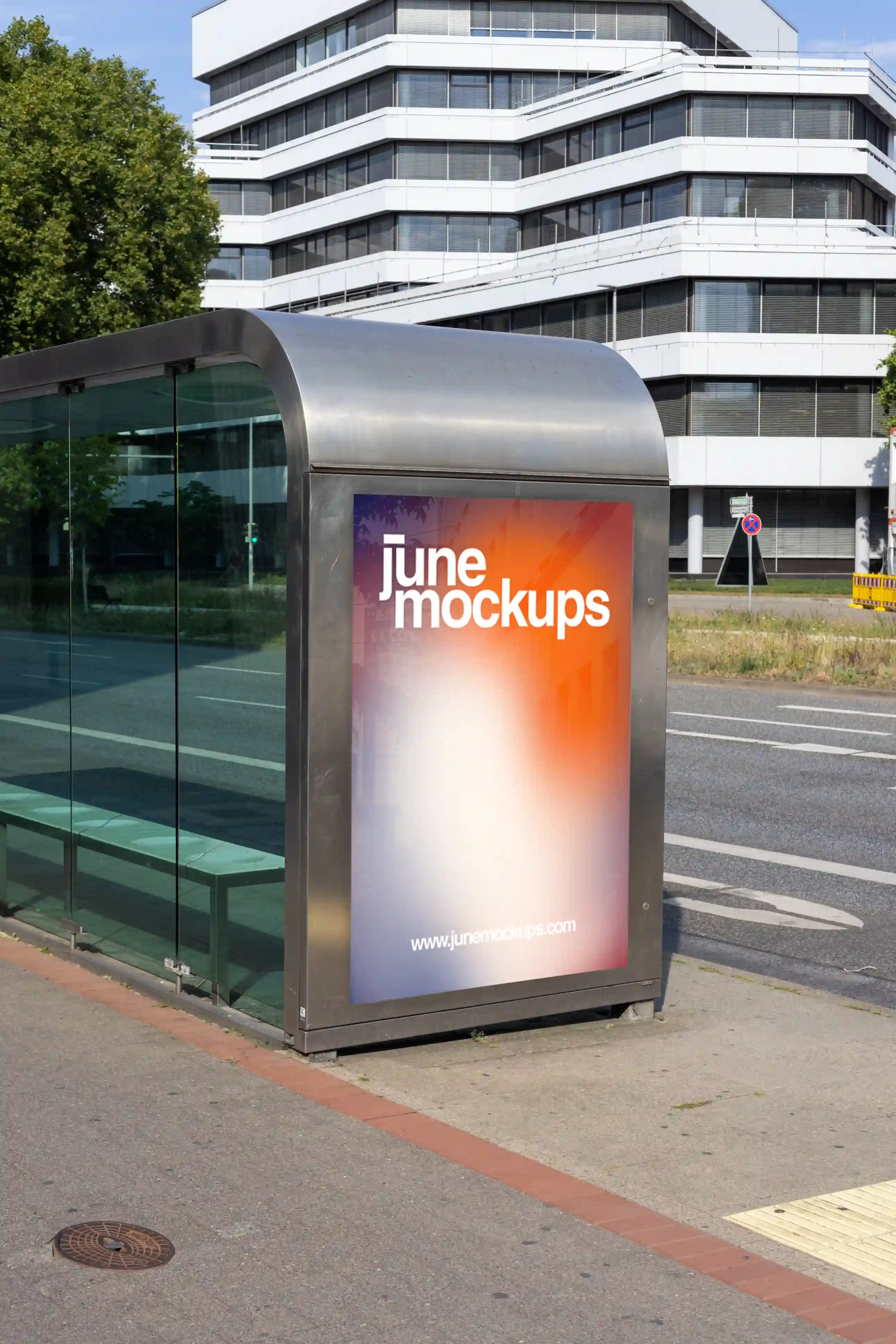 City light poster mockup at a modern glass bus stop in Hanover, Aegidientorplatz. Realistic lighting, street details, and reflections make it perfect for transit advertising or campaign display previews.