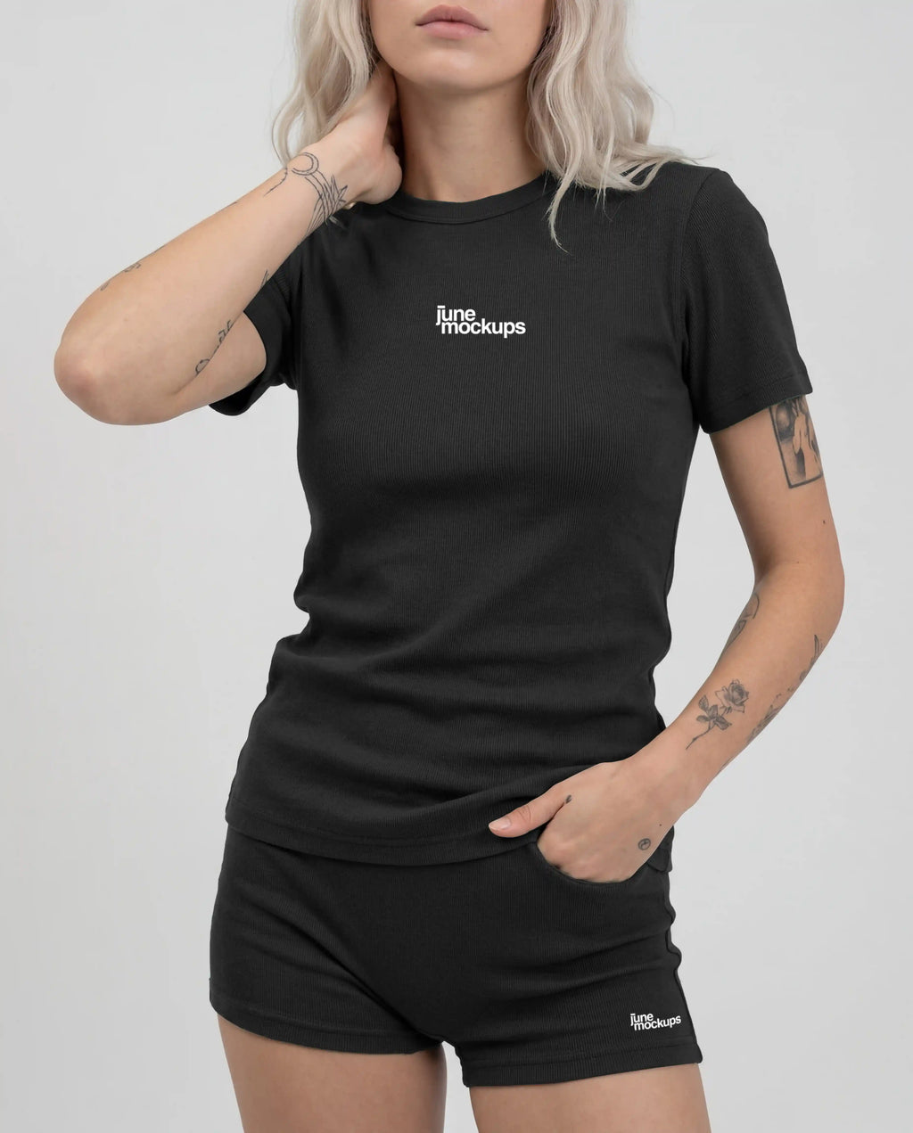 Realistic female black ribbed streetwear t-shirt and shorts mockup with front logo placement, soft studio lighting and visible fabric texture, ideal for apparel branding, fashion labels, merch designs and streetwear product presentations.