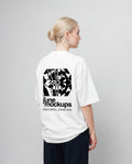 Female white oversized t-shirt mockup with large black back print design, clean studio background and natural fabric folds, perfect for apparel branding, streetwear collections, fashion campaigns, merch designs and clothing label presentations.