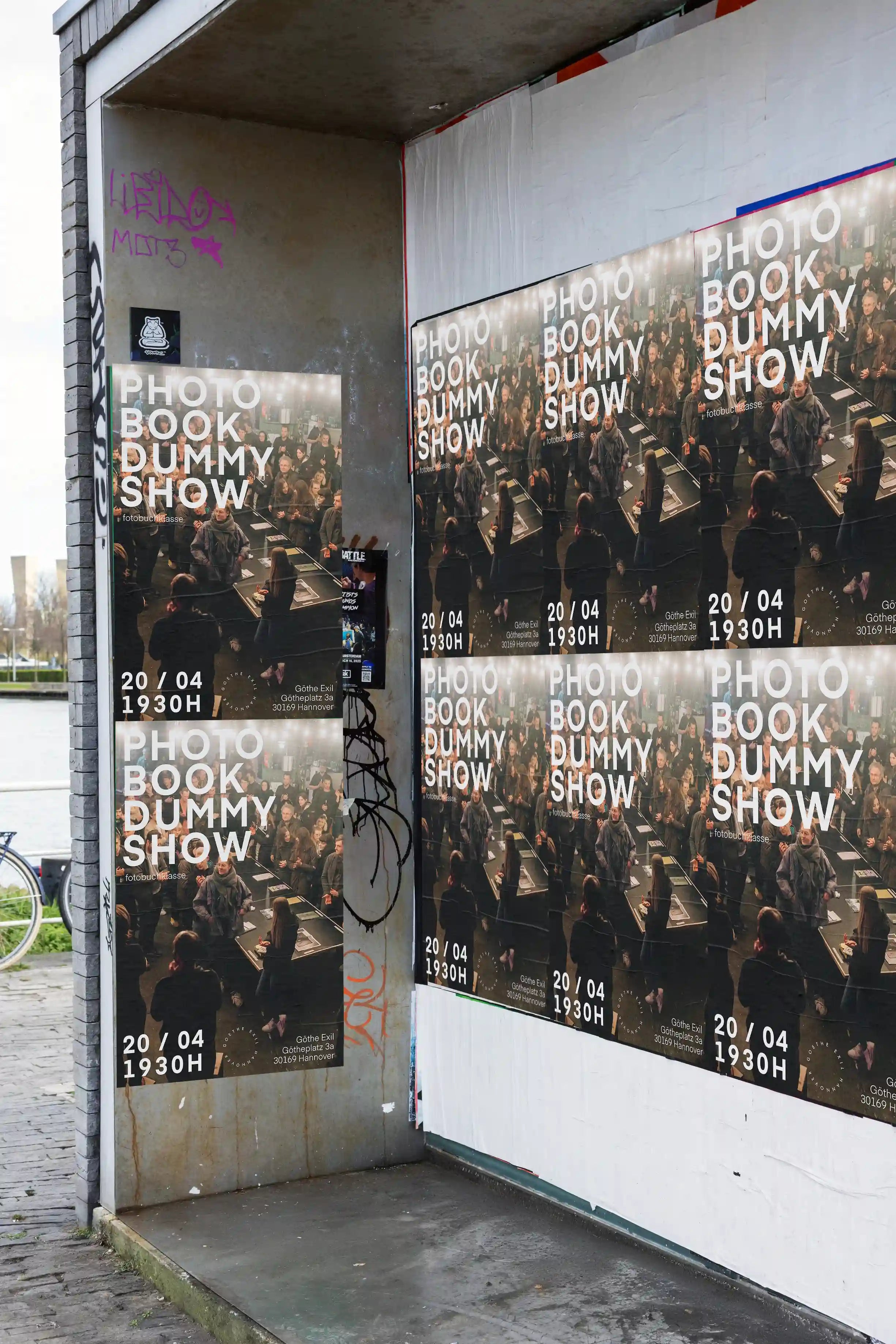 A shiny blue poster featuring abstract metallic artwork pasted on a stone wall with graffiti. Example of a finished mockup result — your uploaded design will be placed just like this, naturally lit and textured.