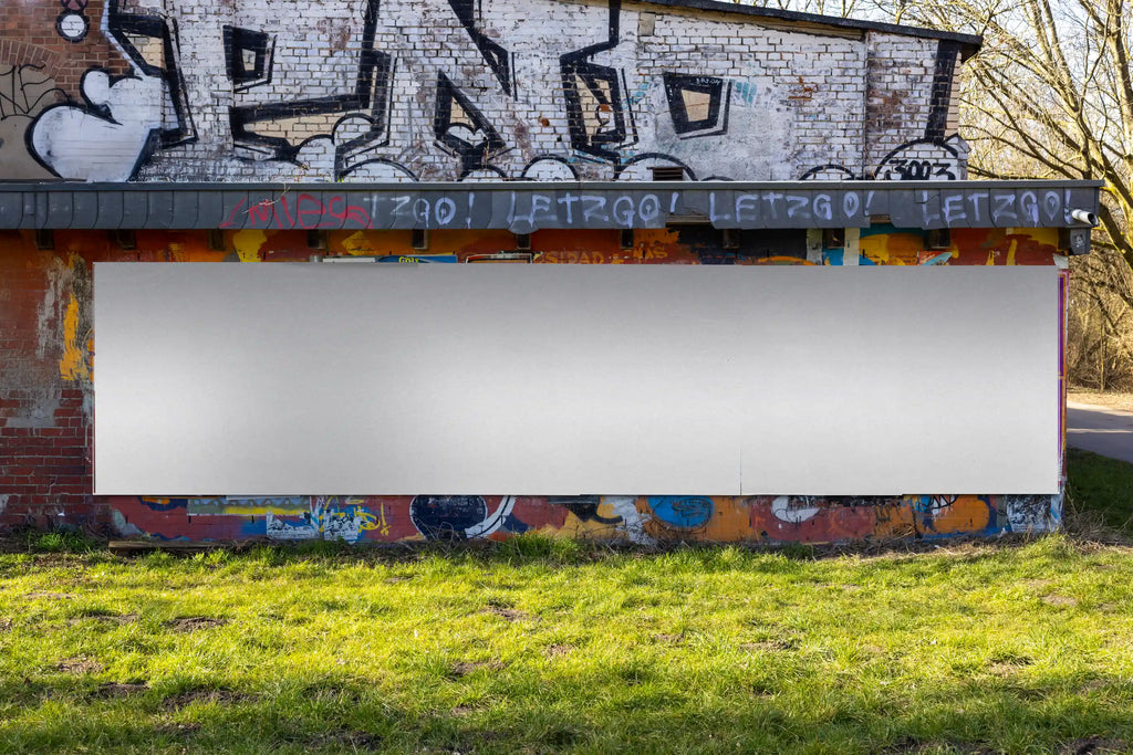 Clean, empty multi-poster mockup template with natural daylight and street textures. Perfect for testing layout compositions, color palettes, and poster arrangements in a realistic urban environment.
