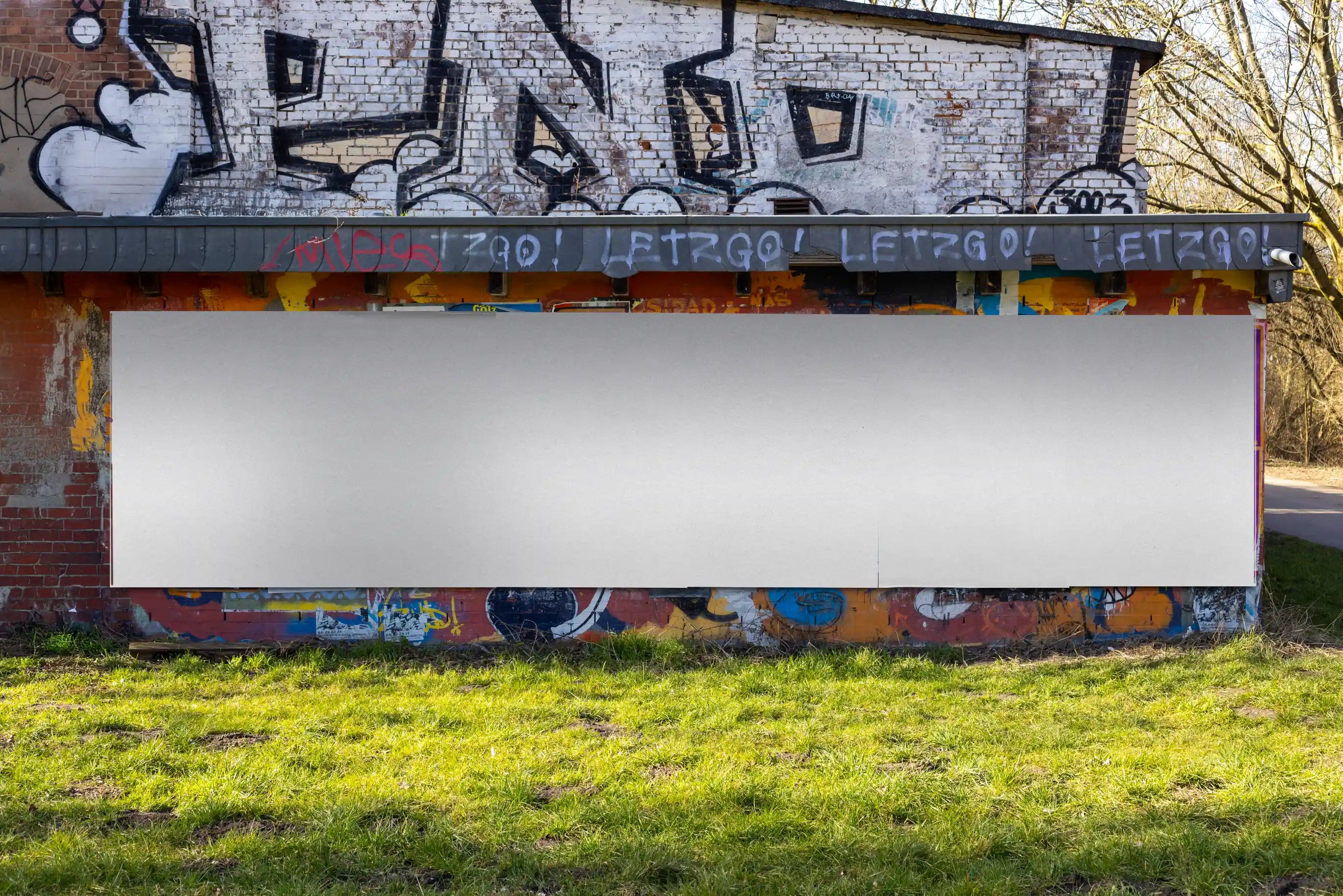 Clean, empty multi-poster mockup template with natural daylight and street textures. Perfect for testing layout compositions, color palettes, and poster arrangements in a realistic urban environment.