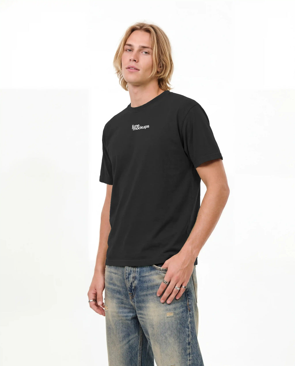 Realistic male black streetwear t-shirt mockup with small front logo placement, relaxed model pose and clean studio setting, ideal for apparel branding, online shop visuals, fashion labels, merch collections and streetwear presentations.