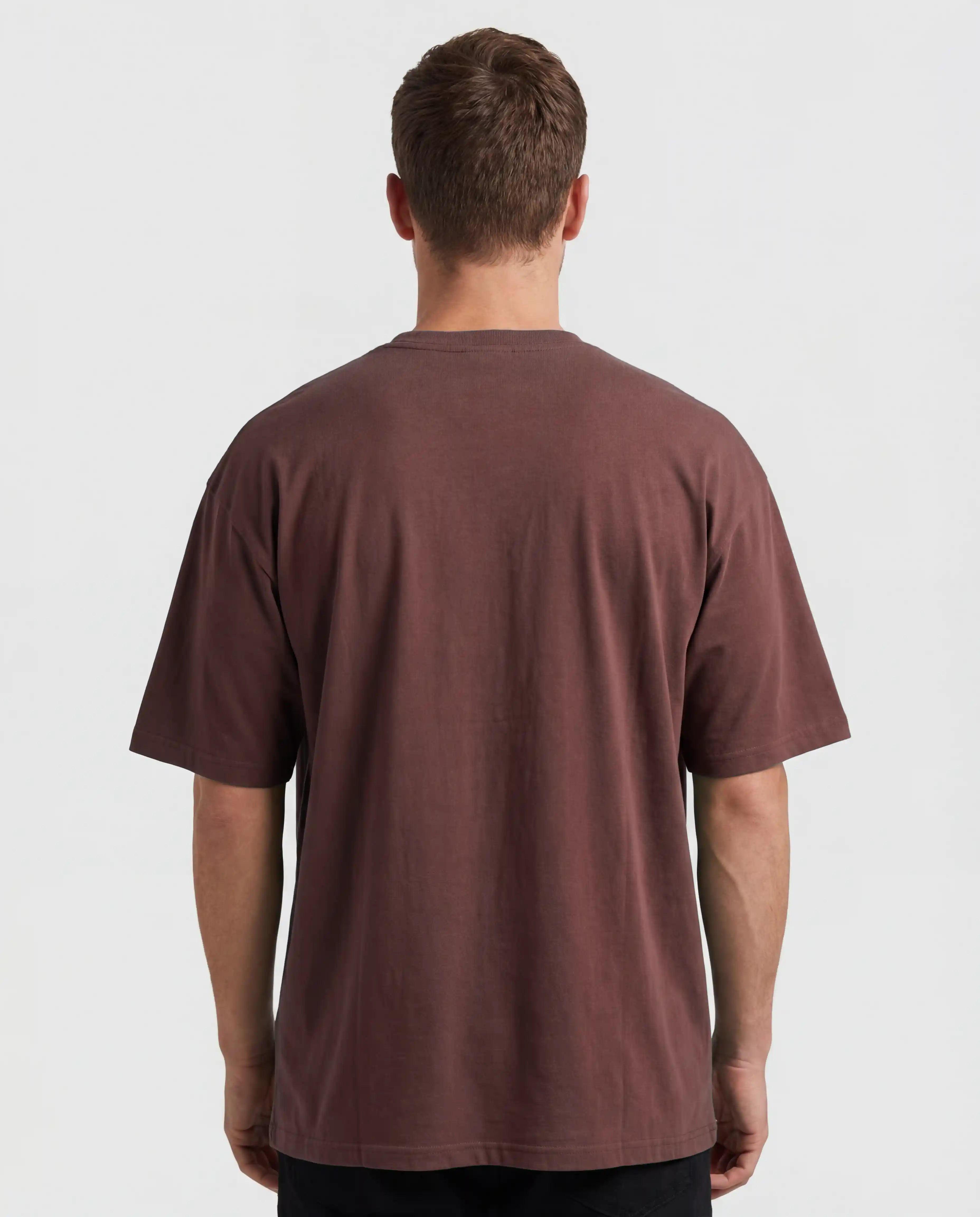 Male oversized t-shirt mockup from the back showing a blank editable shirt surface in brown, clean studio lighting and realistic fabric structure, ideal for back print designs, clothing brands, streetwear collections and apparel presentations.