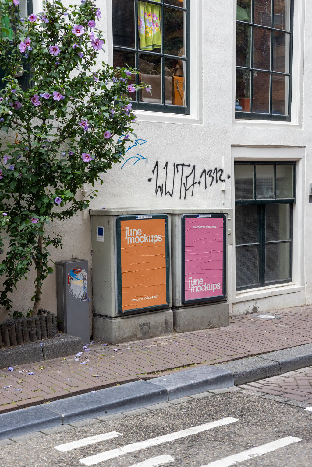 High-resolution poster mockup on utility boxes in a narrow Amsterdam street with flowers, graffiti, and urban textures, perfect for outdoor advertising designs.