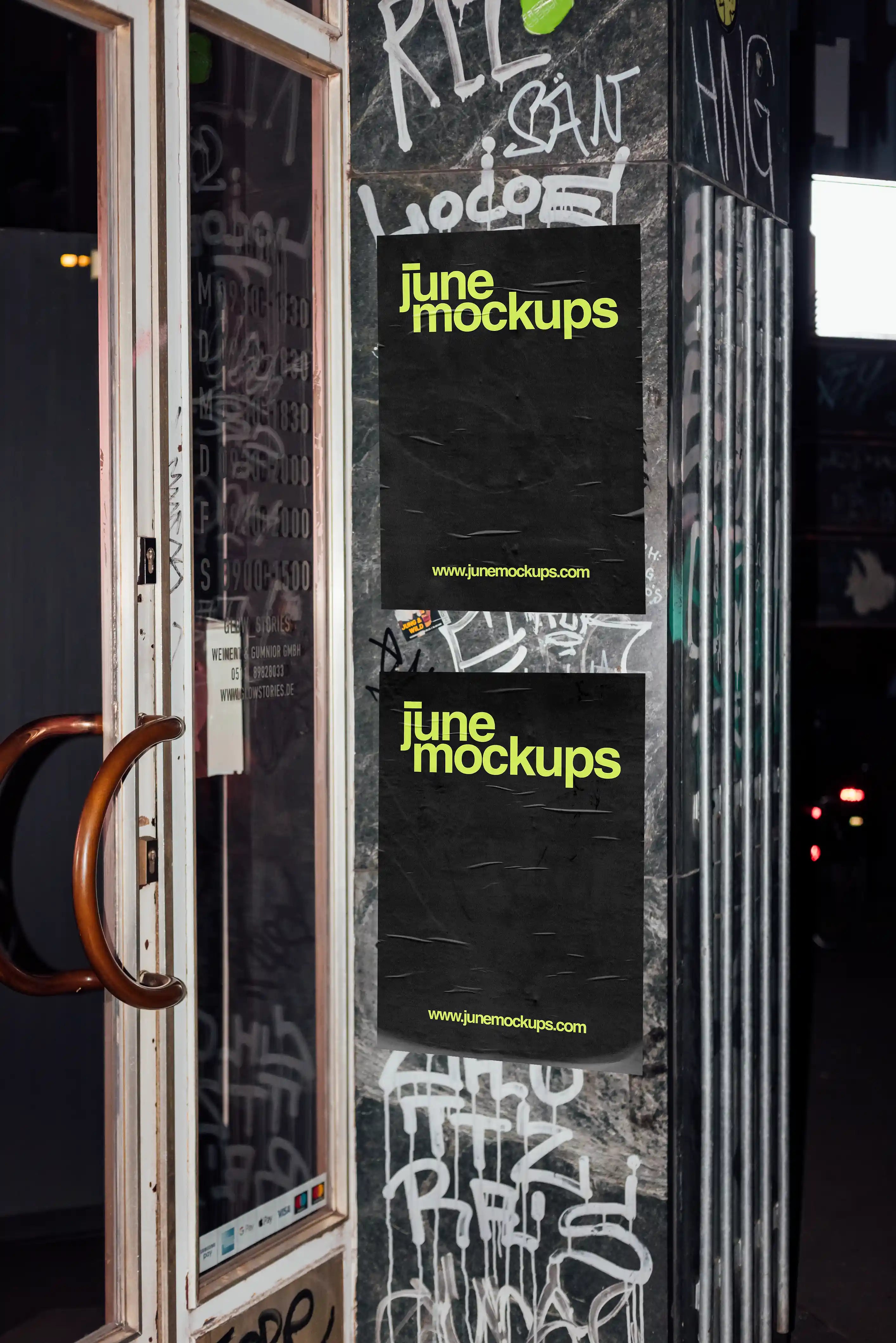 Urban poster mockup with two posters placed on a graffiti-covered street wall next to a door, showcasing a realistic outdoor advertising scene with authentic textures.